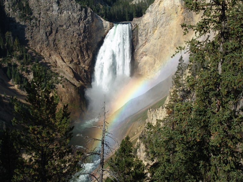 Two waterfalls and a rainbow in the mountains