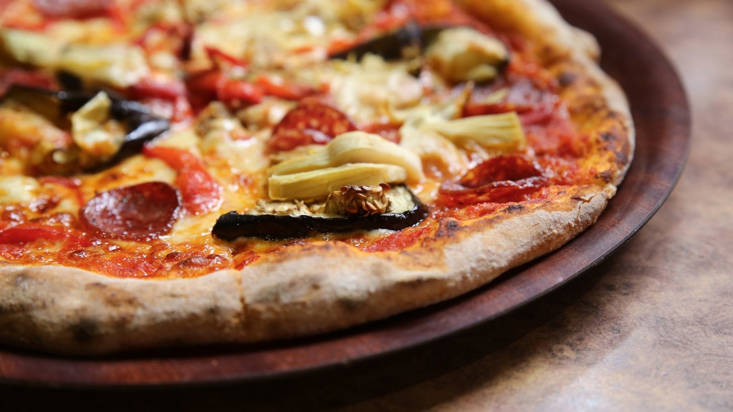 Pizza on a wooden tray