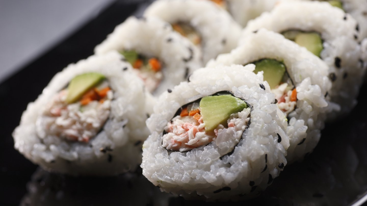 sushi roll on a black plate