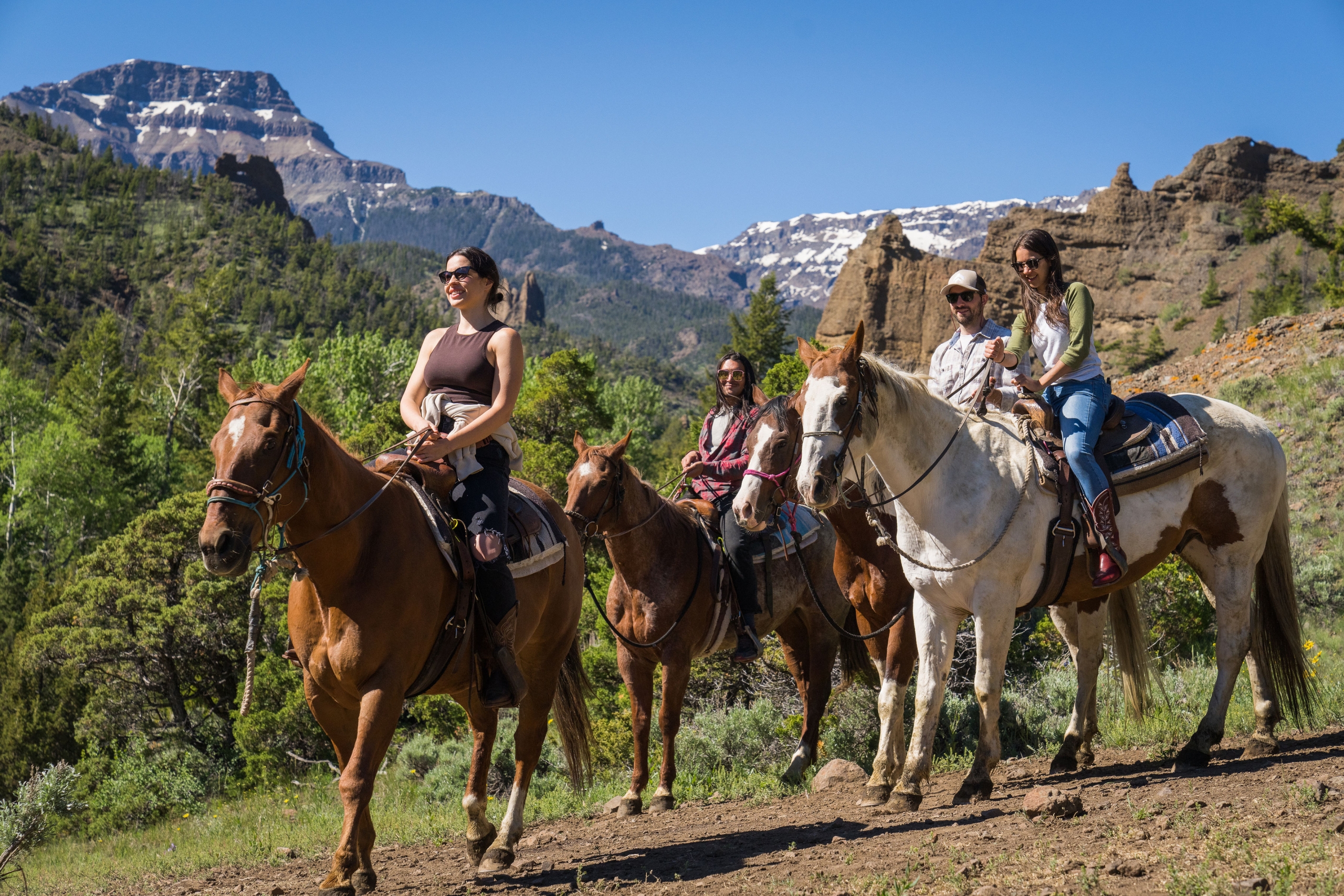 Friends go horseback riding in Cody Yellowstone