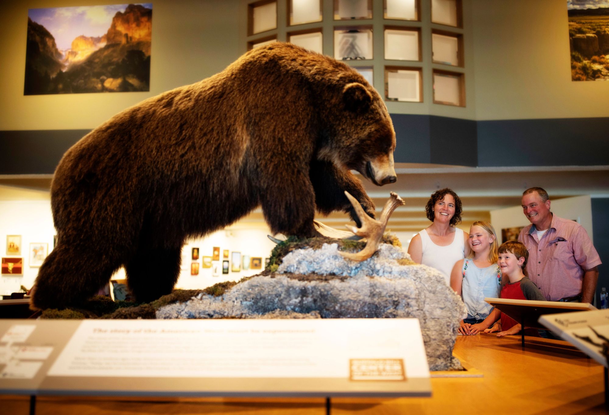 A family enjoys exploring the Buffalo Bill Center of the West in Cody Yellowstone