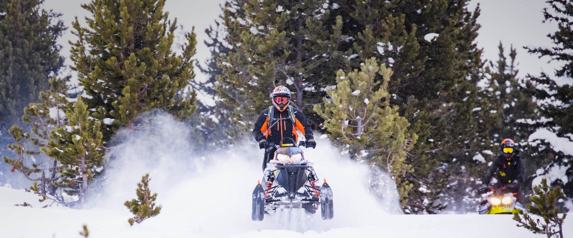 A person riding a snowmobile