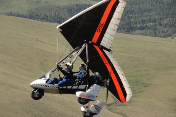 A few people hang gliding