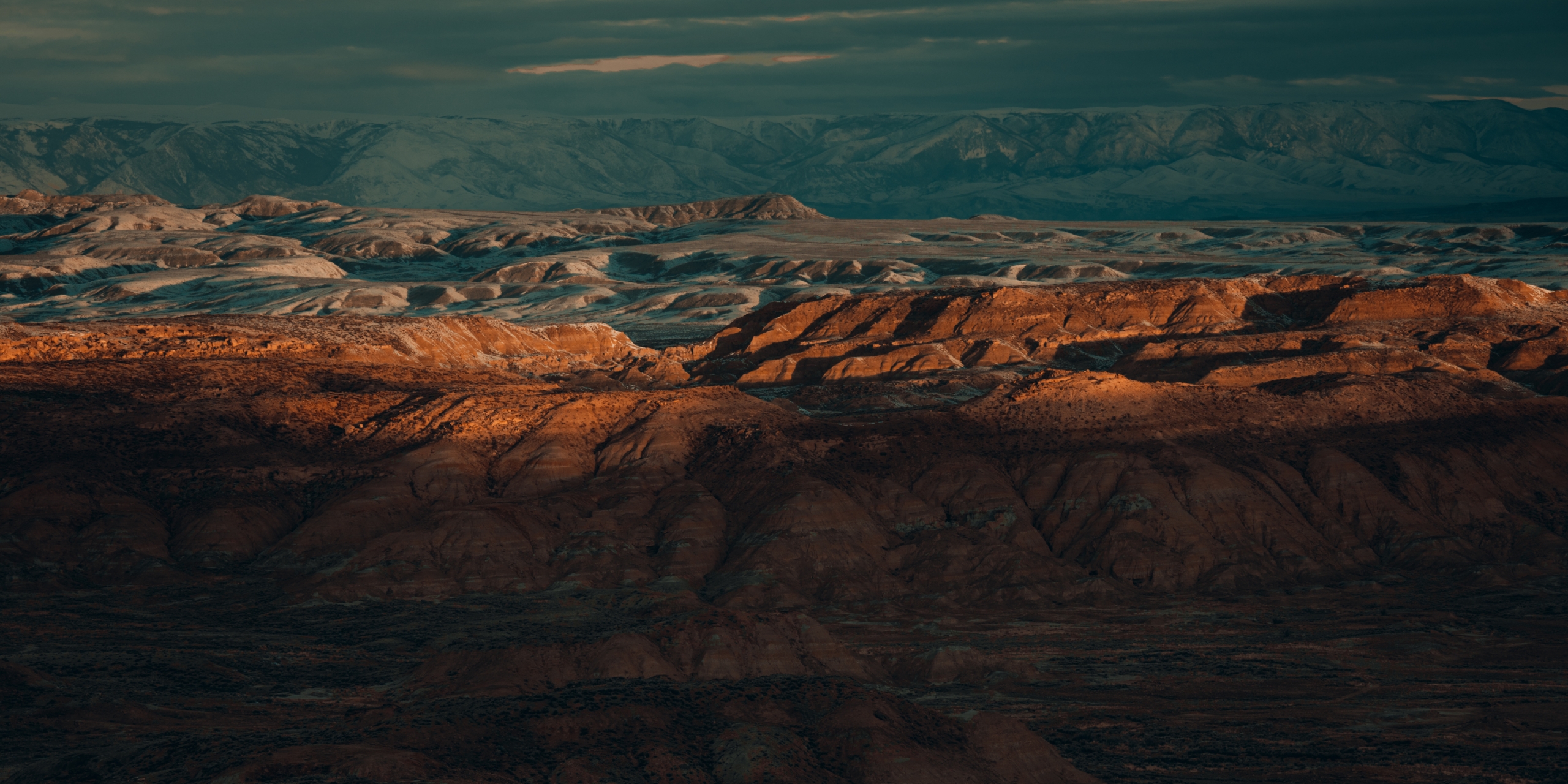 Sun setting on mountain peeks