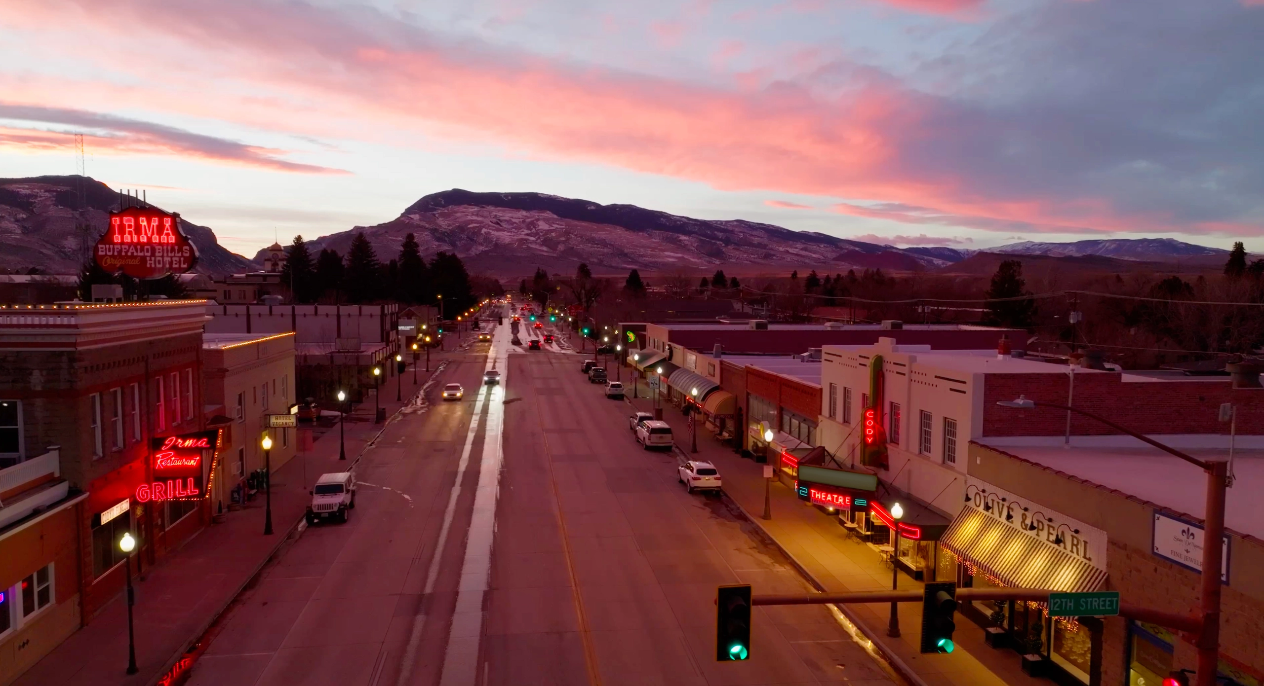 Aerial view of Cody, overlooking a main street with a mountain in the background