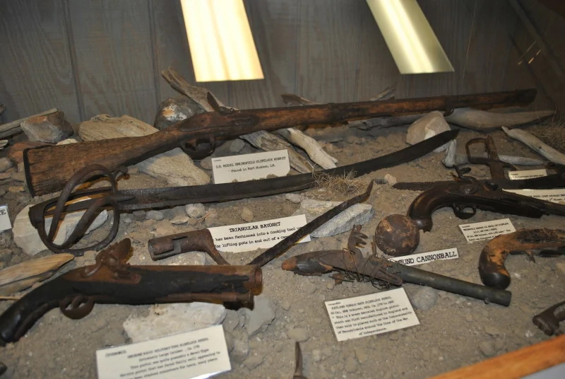 A display case showcasing various weapons and unique items, highlighting their intricate designs and historical significance