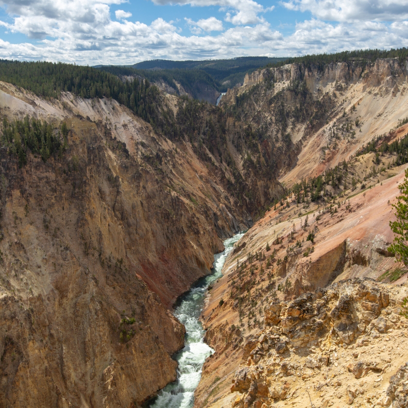 A stunning view of Yellowstone National Park showcasing the Grand Canyon's vibrant colors and breathtaking landscapes