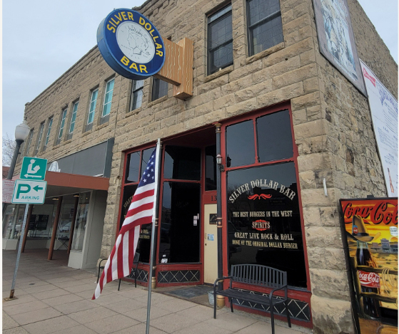 Front view of a building displaying a sign that says 