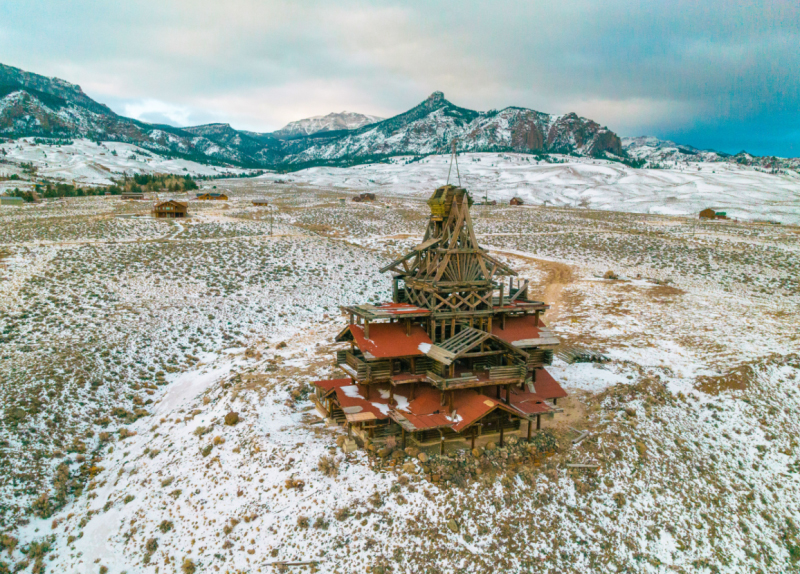 Snow blankets the roof of a building, captured from above, highlighting the serene winter scene