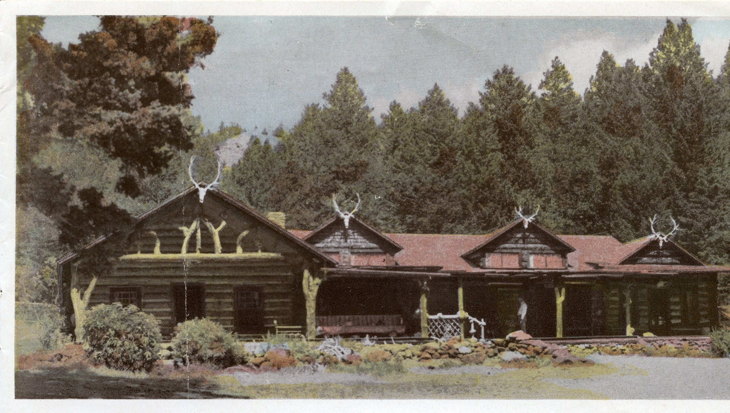 Exterior of Holm Lodge with antlers on the roof points