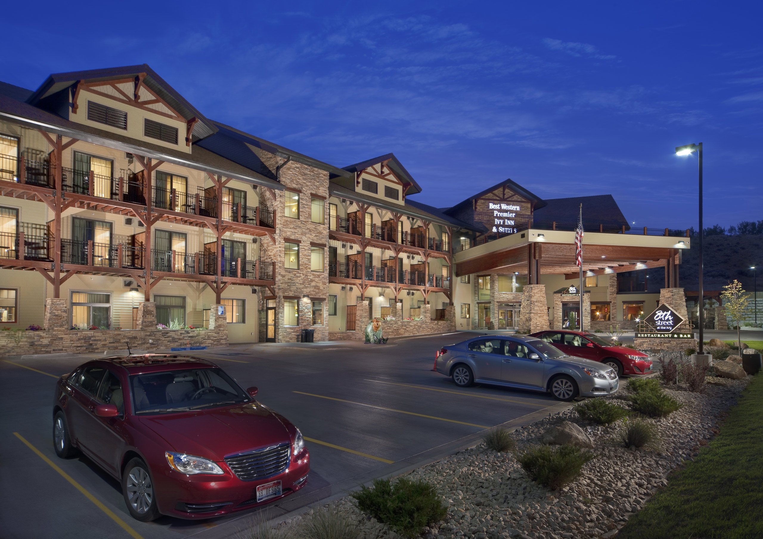 The Best Western Inn stands beautifully at dusk, its exterior lit up, creating a cozy and inviting atmosphere