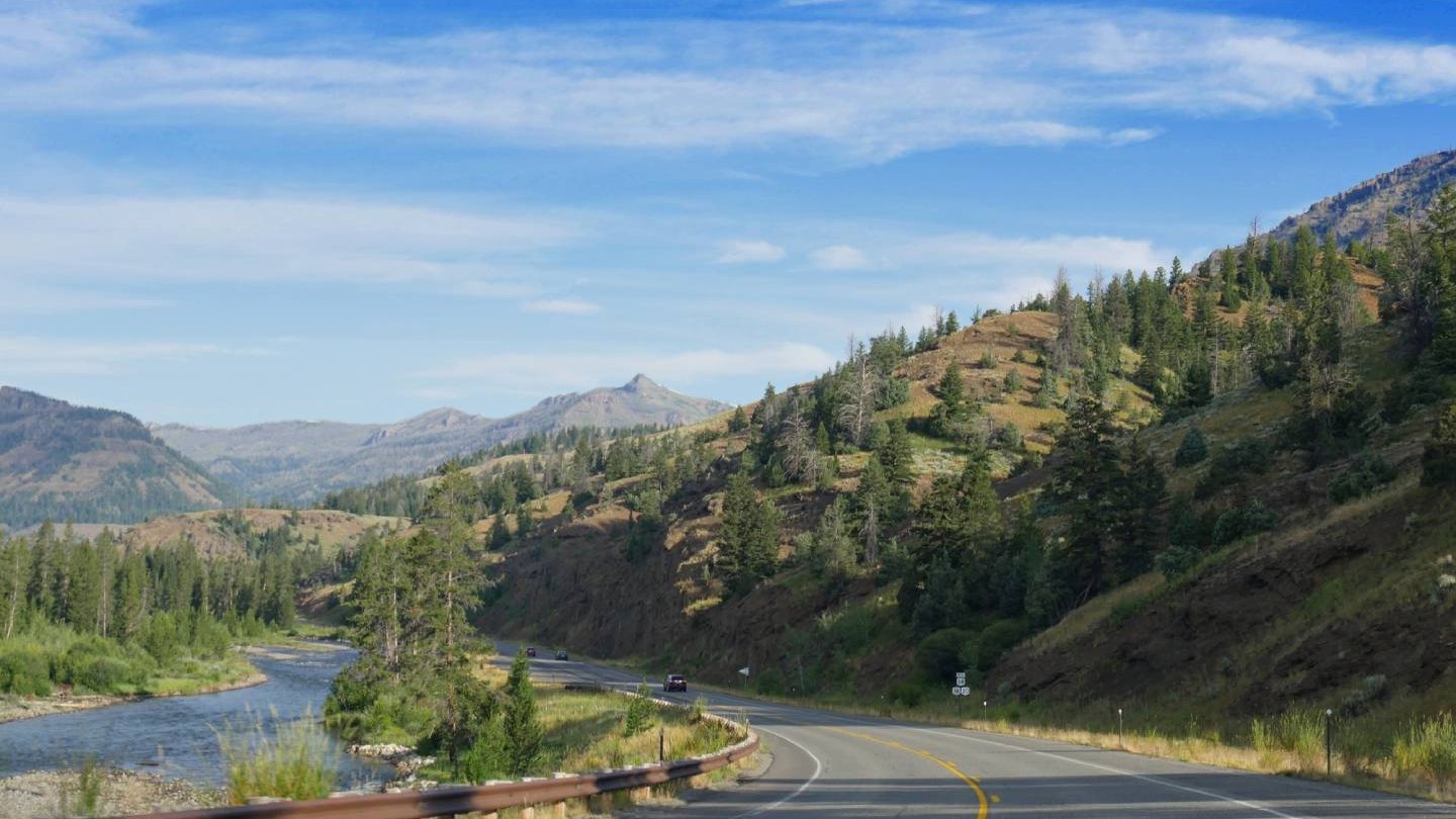 A car on the highway in Cody Yellowstone.