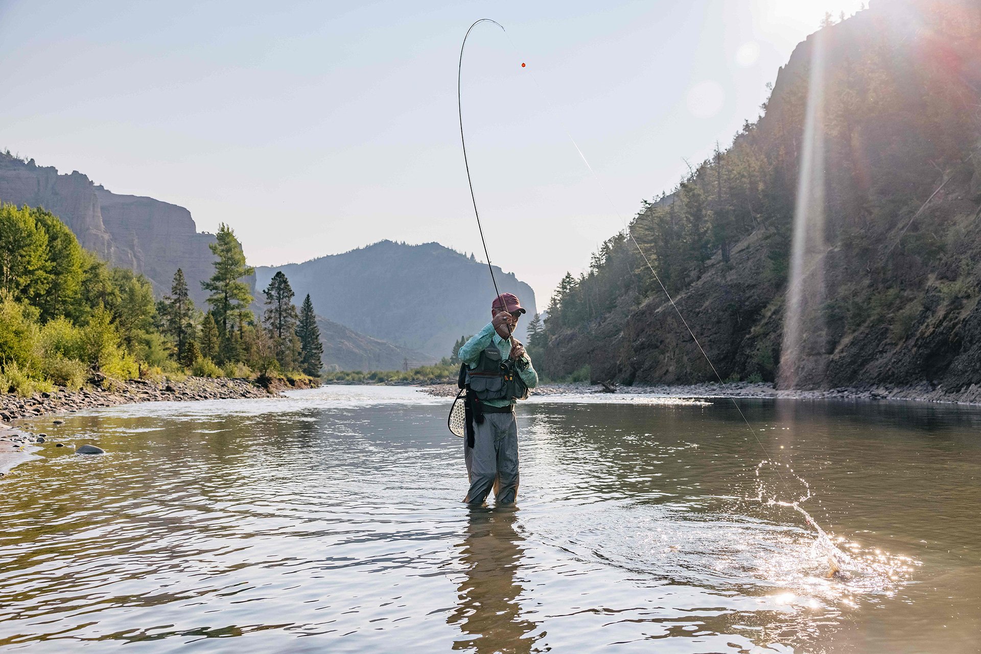 A man fishing in a river in Cody Yellowstone