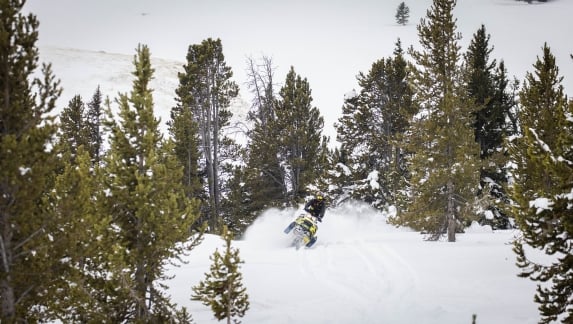 A person riding a snowmobile