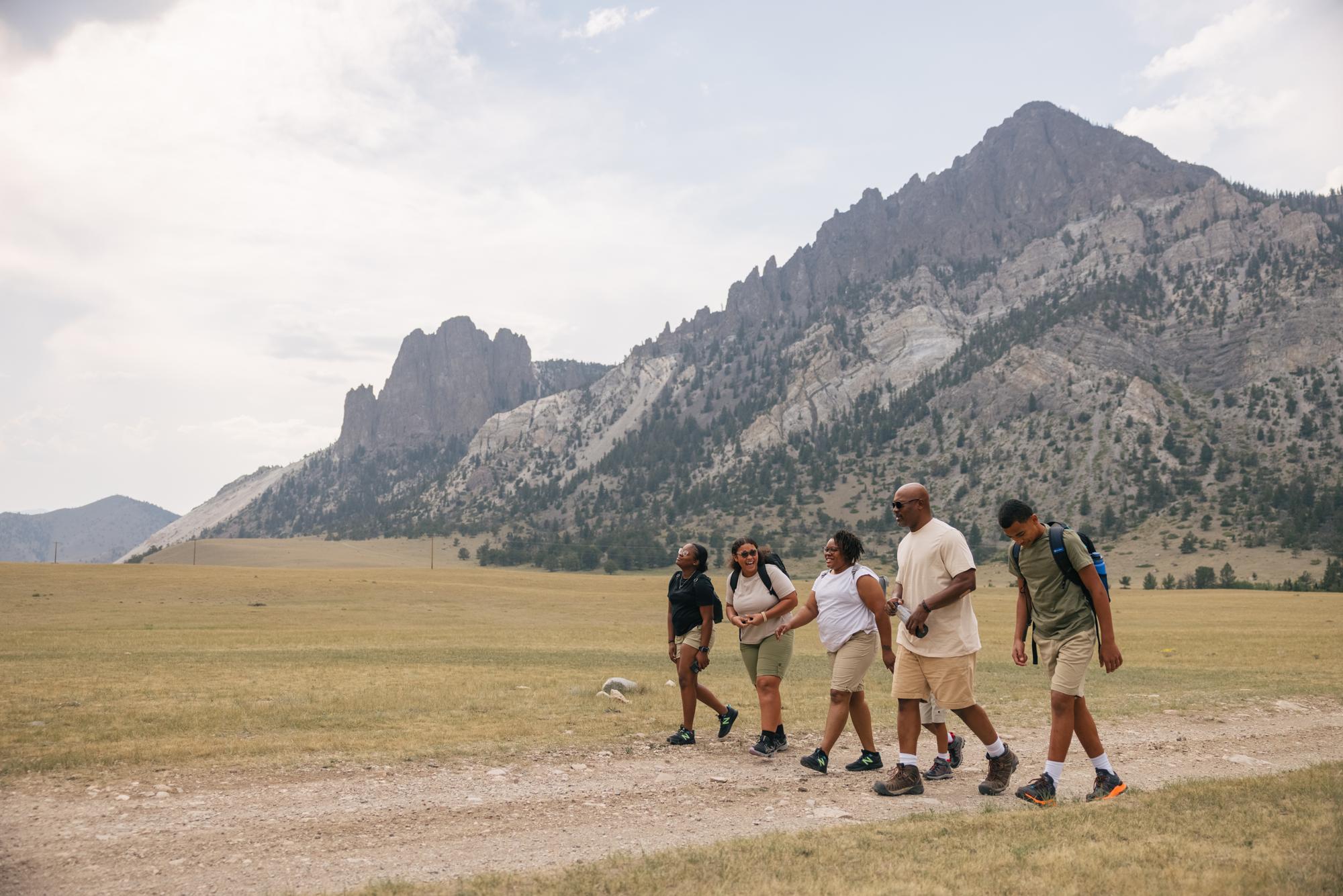 a family hiking on a dirt road