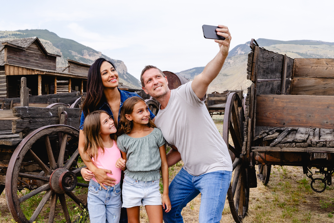 A family takes a photo at Old Trail Town