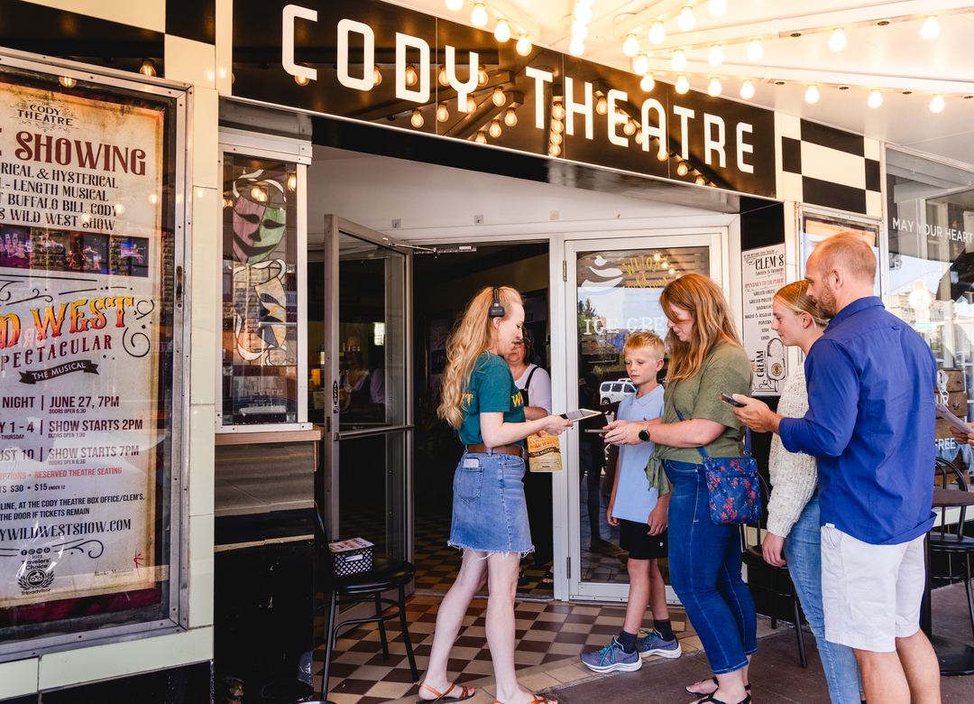 A family visits the Cody Theatre