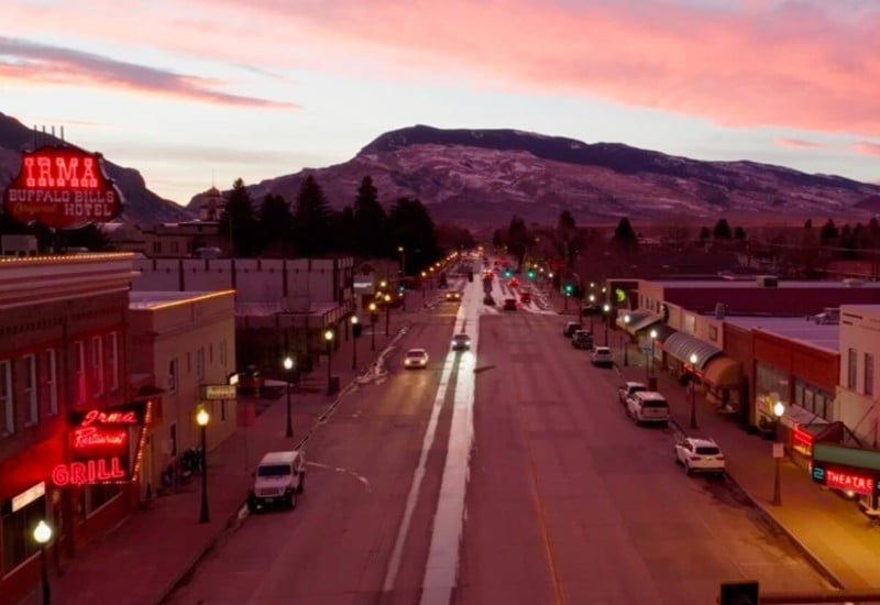 Main street at sunset with the mountains in the background.